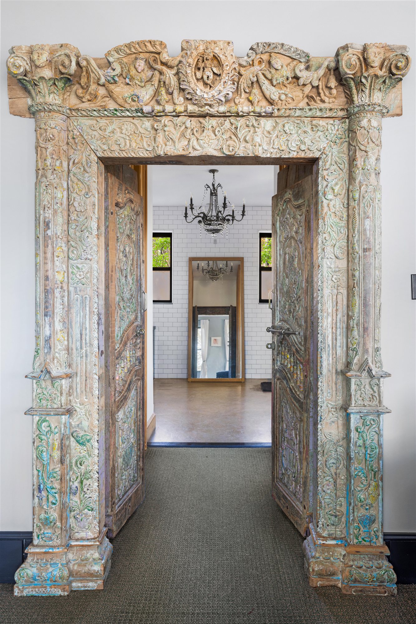 One of the home's hand-carved antique doorways