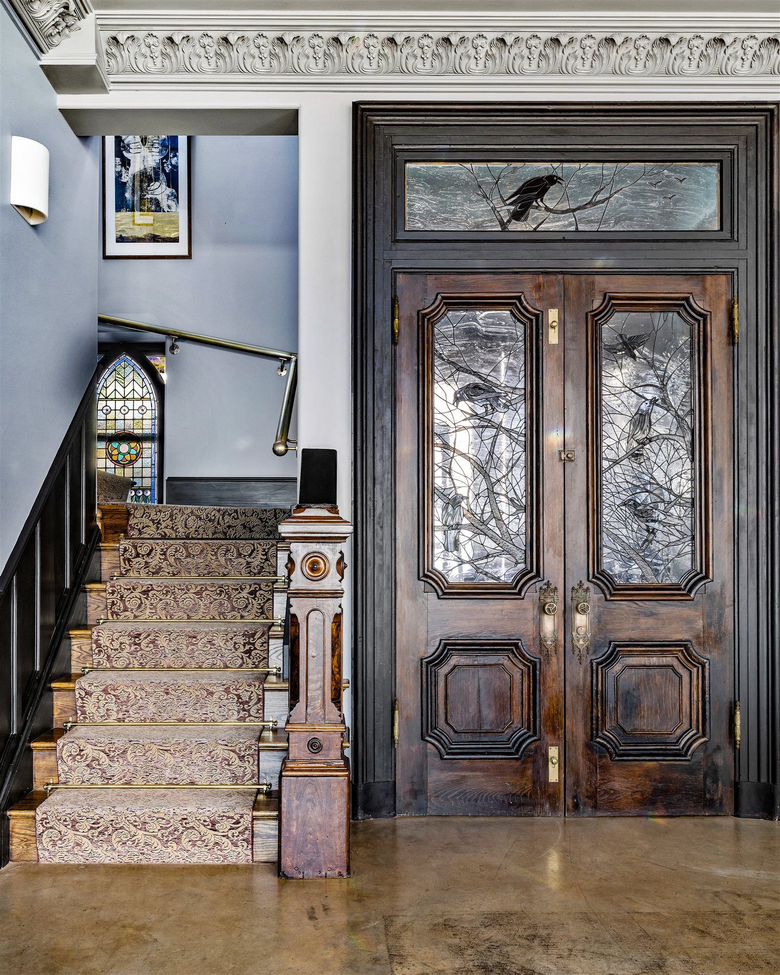 The entry — hand-carved antique doors