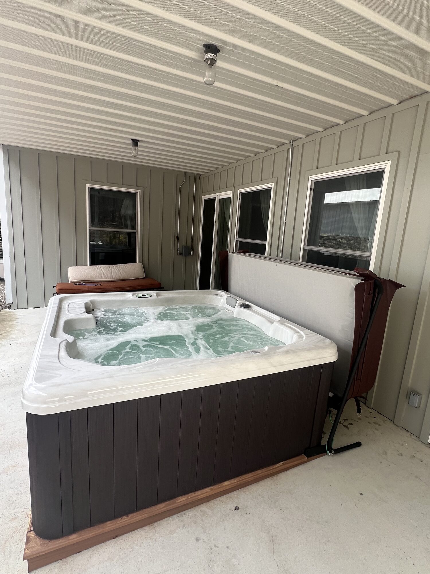 The hot tub on the covered porch